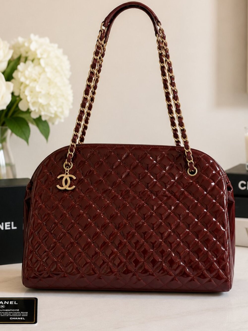 Rare CHANEL Mademoiselle Bowler in rich burgundy patent leather